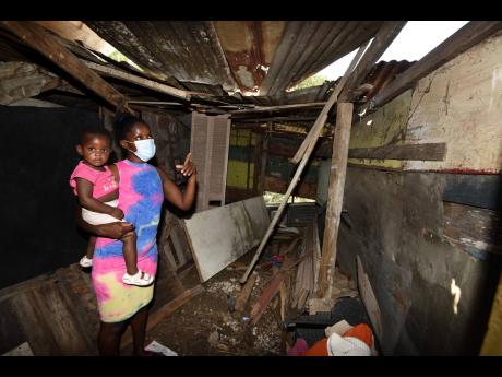 Exposed roofing that caused Natasha Jones and her seven kids to get wet whenever it rained.