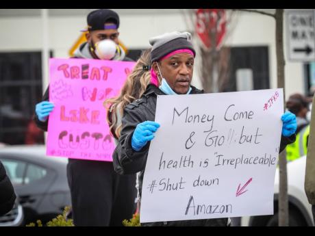 Workers at an Amazon location in Staten Island, New York, protest working conditions over COVID-19 virus spread fears. 