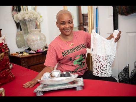 Swaydean Simpson shows off one of her craft creations at her home in Fletchers Land, Kingston, from which she operates a business after an accident triggered her interest in craft.