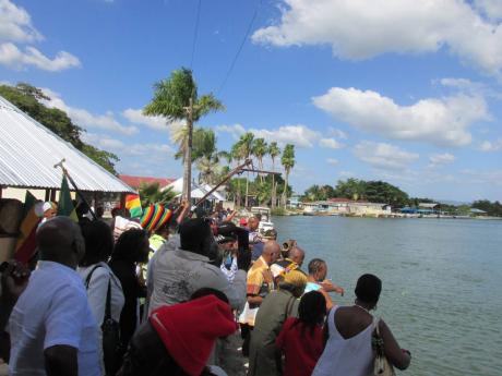 
People offer flowers at Black River, St Elizabeth, in this 2015 file photo. They were participating in a ceremony to remembrance of the Zong Massacre between November 29 and December 1, 1781.
