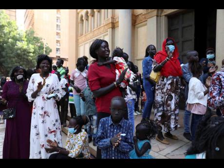 Credit: AP Sudanese Christians celebrate Christmas mass outside in Khartoum, Sudan on Christmas Day.
