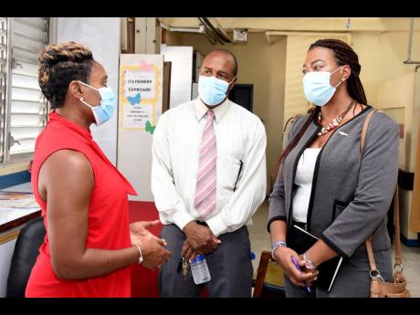 Minister of State in the Ministry of Health and Wellness, Juliet Cuthbert-Flynn (left), speaking with Burknell Stewart (centre), CEO of KPH and VJH, and Diane McIsaacs, deputy CEO, KPH and VJH, at the opening ceremony for the new breastfeeding room that wa