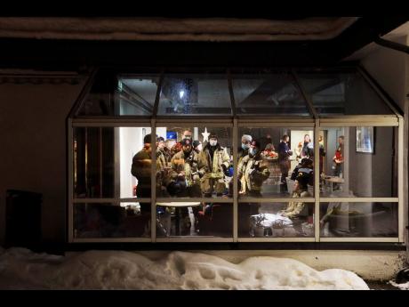 Credit: AP Rescue crews gather in Ask in Gjerdrum, northeast of Oslo, Norway, on Saturday night.