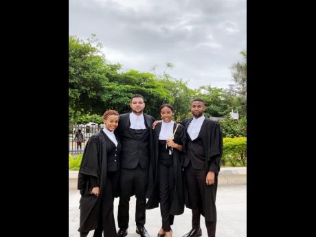 Young attorneys share lens time hours after passing the Bar. From left: Caleigh Reid, Duncan Roye, Ashley Innis and Syl-Don O’Gilvie