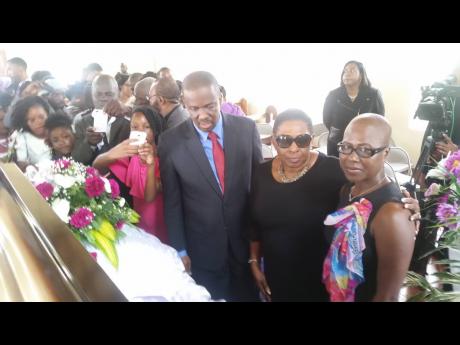 Culture Minister Olivia ‘Babsy’ Grange is flanked by Pastor Devon Dick, then president of Jamaica Baptist Union, and Beverly Fray, granddaughter of Violet Moss-Brown at the centenarian’s funeral in Duanvale, Trelawny, in October 2017.