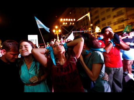 Anti-abortion activists react after lawmakers passed a bill that legalises abortion, outside Congress in Buenos Aires, Argentina, December 30, 2020. 