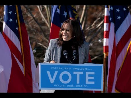 Vice President-elect Kamala Harris campaigns for Democratic US Senate challengers Rev Raphael Warnock and Jon Ossoff on December 1, 2020, in Columbus, Georgia.