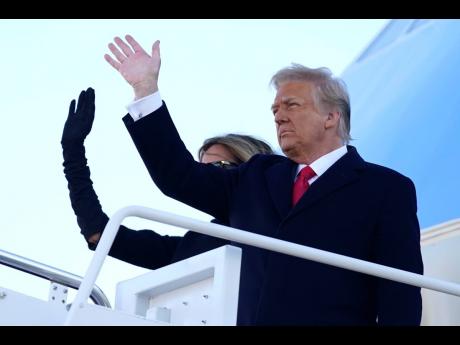 President Donald Trump and first lady Melania Trump board Air Force One at Andrews Air Force Base, Maryland, yesterday. 