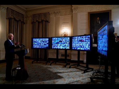 President Joe Biden speaks during a virtual swearing in ceremony of political appointees from the State Dining Room of the White House on Wednesday, January 20, 2021, in Washington. 