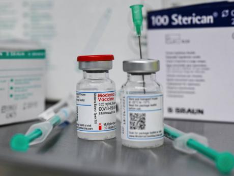 Small bottles containing Moderna’s active ingredient for a Corona vaccination are pictured at the vaccination centre in Eberswalde, Germany, Wednesday, January 27, 2021. 