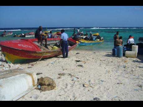 In this file photo fishermen are seen at Pedro Cays. 