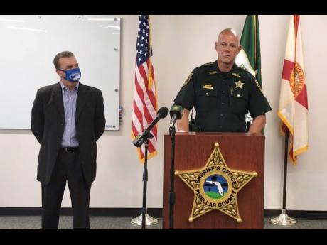 In this screenshot from a YouTube video posted by the Pinellas County Sheriff’s Office, Pinellas County Sheriff Bob Gualtieri speaks during a news conference as Oldsmar Mayor Eric Seidel listens on Monday, February 8, in Oldsmar, Florida.