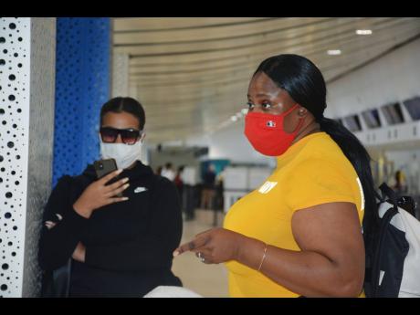 Credit: Photo by Janet Silvera Kidnap hoaxer Kalina Collier (left), who spawned a viral rumour that she was being held hostage at a Jamaican hotel, is seen beside her Jamaica-born mom Candice Walker, who drove her to the Sangster International Airport in Montego Bay to catch her flight