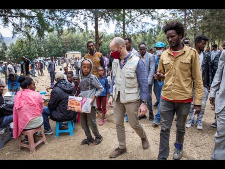 Manuel Fontaine, UNICEF Director of the Office of Emergency Programmes, centre, visits internally-displaced people in Adigrat Town, in the Tigray region of northern Ethiopia.