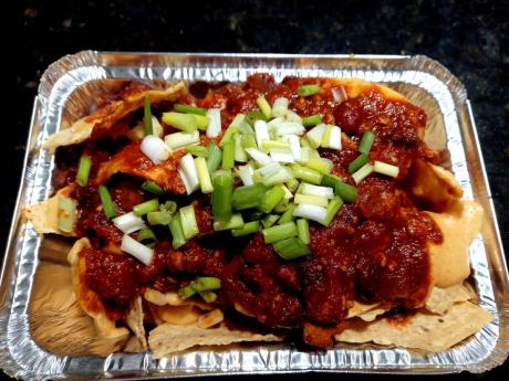 There’s a mouthful of flavour in each bite of this vegan chilli which includes tofu chunks on a bed of crispy nachos.