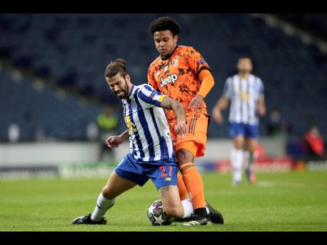 Juventus’ Weston McKennie (right) vies for the ball with Porto’s Sergio Oliveira during the Champions League round of 16, first leg match between FC Porto and Juventus at the Dragao stadium in Porto, Portugal, Wednesday, February 17, 2021. 