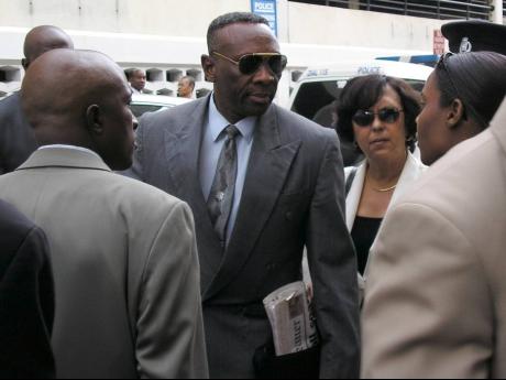 File 
Senior Superintendent of Police Reneto Adams (centre) leaves the Home Circuit Court on January 17, 2005 after turning out to support his colleagues charged with the Braeton Seven murders.