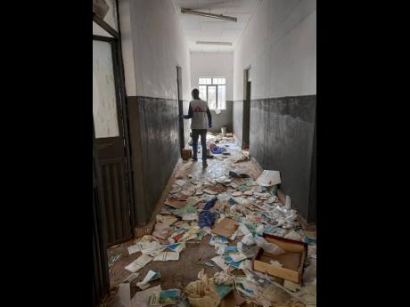 In this undated 2021 photo released by Medecins Sans Frontieres, a man walks along a corridor in a vandalised health centre in May Kuhli, in the Tigray region of northern Ethiopia. Amid the unrest, rating agency Moody’s has downgraded Ethiopia over debt 