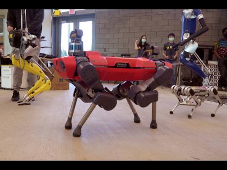 In a frame grab from video, robots walk across the floor of the University of Michigan’s Ford Motor Company Robotics Building, March 12, 2021 in Ann Arbor, Michigan.