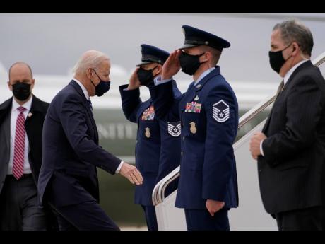 United States President Joe Biden boards Air Force One at Andrews Air Force Base in Maryland on Tuesday en route to Philadelphia International Airport.