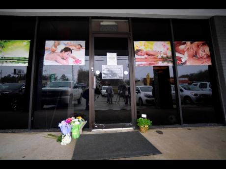 A makeshift memorial is seen outside a business where a multiple fatal shooting occurred on Tuesday in Acworth, Georgia.
