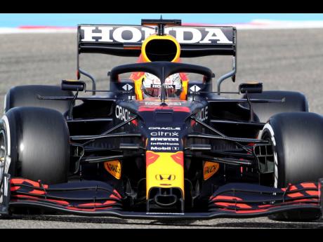 Credit: AP Red Bull driver Max Verstappen steers his car during the third free practice at the Formula One Bahrain International Circuit in Sakhir, Bahrain, Saturday, March 27, 2021. The Bahrain Formula One Grand Prix will take place on Sunday. (AP Photo/Kamran Jebre