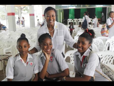 Shauna Fuller Clarke with students at The Queen’s School.