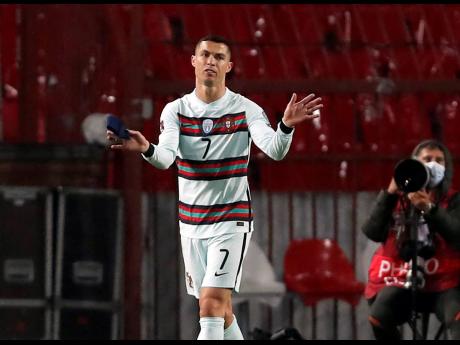 Portugal's Cristiano Ronaldo, holding his captain's armband, reacts to having his goal disallowed during their FIFA World Cup 2022 group A qualifying match against Serbia at the Rajko Mitic Stadium in Belgrade, Serbia on Saturday, March 27.