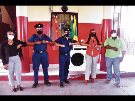 Jamaica Energy Partners (JEP) Corporate Social Responsibility (CSR) Committee member, Cherries Wiles; officer in charge of operations (Area 1), Joshua Davis; assistant commissioner (Area 1), Alarick Hacker; JEP CSR Committee member, Kaytana Davis; and West