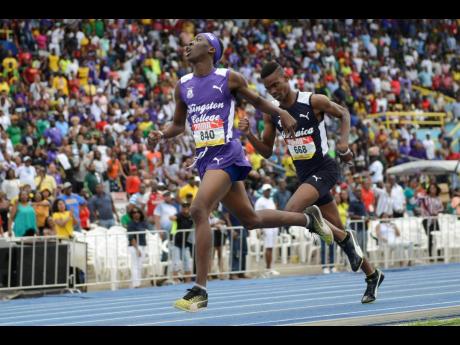 
Giovouni Henry of Kingston College (left) wins the boys’ Class Two 800-metre at the ISSA/GraceKennedy Boys and Girls’ Athletics Championships held at the National Stadium on Saturday, March 30, 2019.