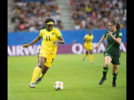 Credit: File Reggae Girl Khadija Shaw (left) in action against Australia's Karly Roestbakken at the Stade des Alpes in Grenoble, France during the FIFA Women's World Cup on Tuesday, June 18, 2019.