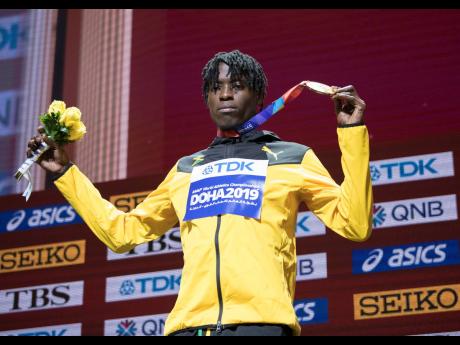 Tajay Gayle poses on the medal podium after taking gold in the long jump at the  2019 IAAF World Athletic Championships, held at the Khalifa International Stadium in Doha, Qatar, on Sunday September 29, 2019.