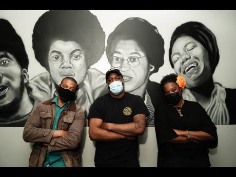 From left: New York State Senator Jabari Brisport, Jon Yearwood, owner of The Burger House and Tahirah Moore, community activist. 
