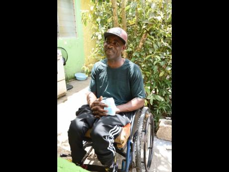 Kenneth Dennis was shot by gunmen while waiting to play a game of dominoes in August Town. He is crippled from the waist down.