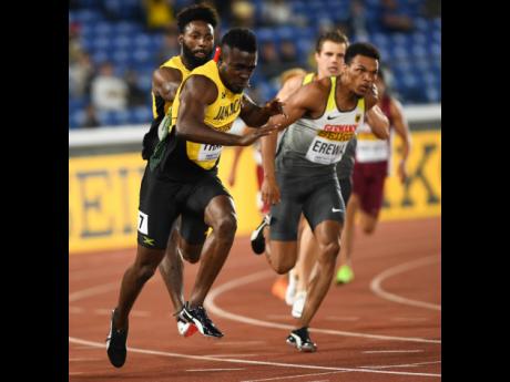 Rasheed Dwyer (background left) hands off the baton to Tyquendo Tracey (foreground left) in the men’s 4x100m relay at the World Athletics Relays held in Yokohama, Japan on Saturday, May 11, 2019.