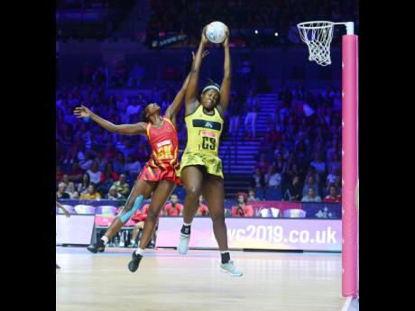Jamaica’s Jhaniele Fowler (right) outjumps Uganda’s Muhayimina Namuwaya to collect a pass during the Netball World Cup at the M&S Bank Arena in Liverpool, England on Thursday, July 18, 2019.