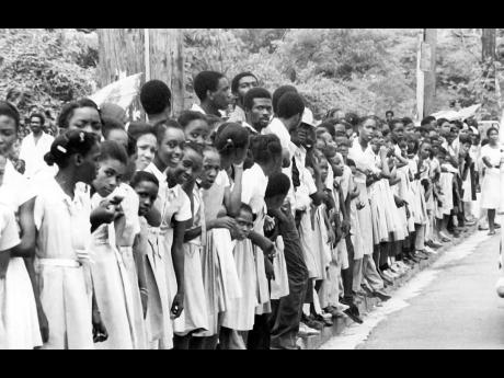Rural school children and teachers took time off from classes to await the Bob Marley funeral procession at a point near Linstead in St Catherine. 
