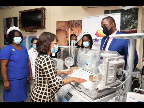 Guardian Life Limited and the Guardian Group Foundation recently donated a touchscreen infant incubator, a radiant warmer, or resuscitaire, and a patient monitor to the Victoria Jubilee Hospital’s Neo-natal Care Unit, valued at over J$2.5 million. Here, 
