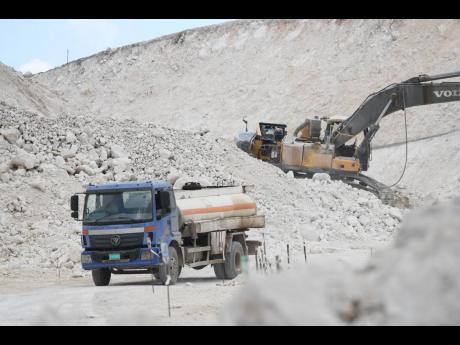 Construction under way on the roadway adjacent to the Grants Pen community in St Thomas by CHEC.