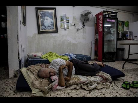 Daniel Turjman, 60, rests in a bomb shelter that is also used as a synagogue nearby his apartment building in Ashdod, Israel, last Wednesday. Since the recent fighting began, the Israeli military has launched hundreds of airstrikes it says are targeting Ha