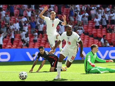 England’s Raheem Sterling celebrates after scoring the only goal during the Euro 2020 group D match against Croatia at Wembley Stadium in London, England, yesterday.