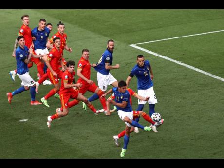 Italy’s Matteo Pessina (foreground) scores the game’s only goal during their final Group A European Championship match against Wales at the Stadio Olimpico in Rome, Italy, yesterday.