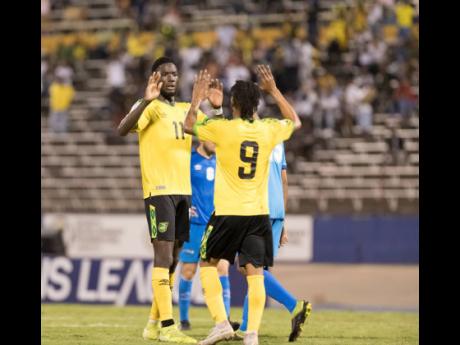 Reggae Boyz Shamar Nicholson (left) and Maalique Foster celebrate the former’s goal against Aruba during a Concacaf Nation’s League game at the National Stadium on Saturday, October 12, 2019.