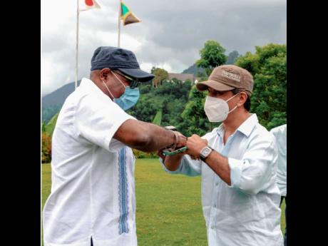 Jamaica’s Tourism Minister Edmund Bartlett (left) and Saudi Arabia’s Minister of Tourism Ahmed Al Khateeb greet each other during a tour at Craighton Estate in Irish Town, St Andrew, on Friday, June 25.