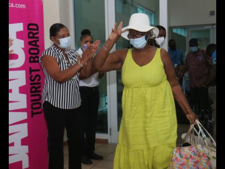 Phyllis Woodrow Anderson arrives on the first Air Canada flight into Jamaica since the North American country imposed COVID-19 travel restrictions. The flight arrived at Sangster International Airport in Montego Bay on Sunday.