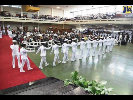 Credit: Contributed Cadets of the Caribbean Maritime University perform a drill at the university’s Charter Day.