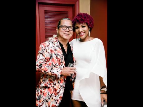 Credit: Nicholas Nunes/Photographer Brian Chung (left), co-director, Ribbiz, and attorney-at-law Roshani Howard at Ribbiz’s 8th anniversary celebrations.