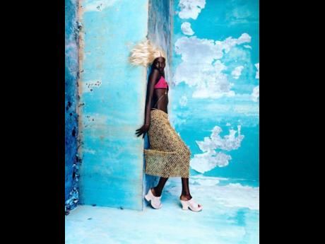 Credit: Luca Khouri Carson is dressed from head to toe in a Katya Zelentsova top, Jacquemus skirt, Bottega Veneta shoes and Aligheri body chain.