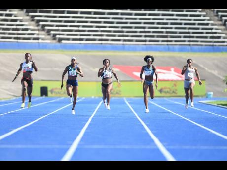 Shelly-Ann Fraser-Pryce (right) finishes fast ahead of Shericka Jackson (left) and Elaine Thompson-Herah in the women’s 200m final at the National Senior Championships at the National Stadium on Sunday, June 27.