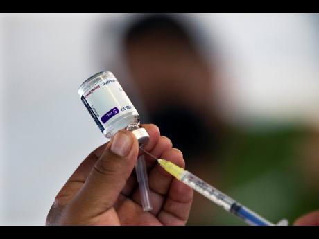 A health worker prepares to administer a jab of the AstraZeneca COVID-19 vaccine in Mexico City on Wednesday.